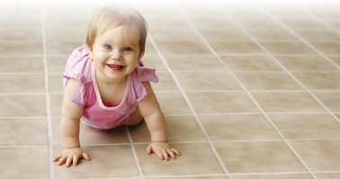 baby on a clean kitchen floor